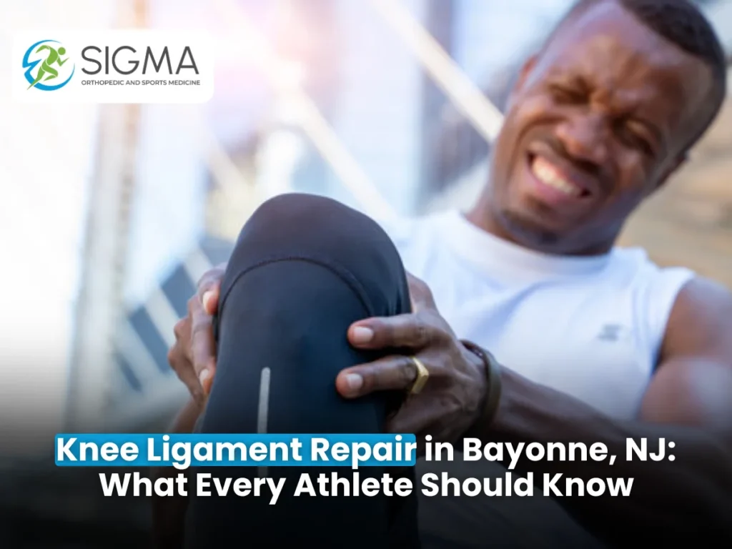 An athlete grimacing while holding his injured knee